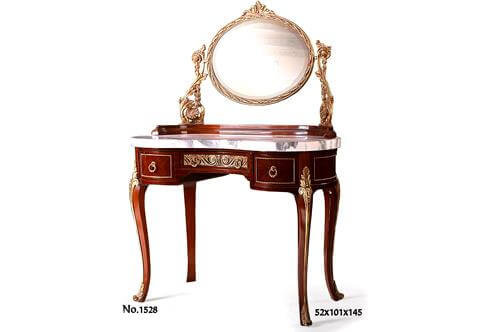 An awe-inspiring French Louis XV Rococo style gilt-ormolu-mounted veneer inlaid Coiffeuse after the model by Maxime Secretant, late 19th-early 20th century. The splendacious kidney-shaped quarter-veneered dressing table is surmounted by an adjustable fine chiseled gilt ormolu oval mirror supported by rococo style scrolled-acanthus and intricate cast uprights, resting on a half circular beveled wooden support above a marble top. The frieze fronted by a central drawer ornamented with an ormolu running hammered background Vitruvian scrolls design with reeded ormolu ring handles, flanked to each side by a short drawer, the convex sides and the short drawers are framed with ormolu trim. The coiffeuse  stands on tapering cabriole legs headed by an intricate ormolu acanthus foliate clasps running to scroll-acanthus sabots